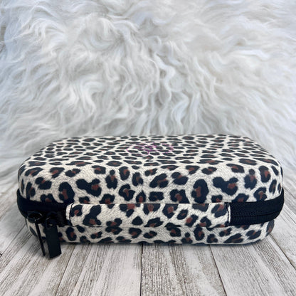 Travel Size Leopard Print Fancy Band Storage Case — Case made of PU leather, Nylon, Multi spandex, Lycra Dimensions are W 8 1/2" x L 5 1/2" x H 2 1/4" This item is storage case only bands not inclu...