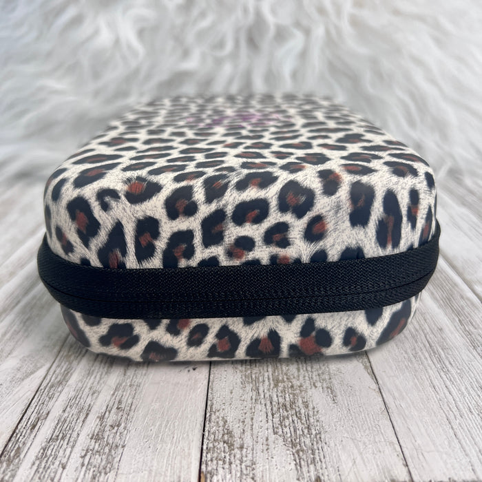 Travel Size Leopard Print Fancy Band Storage Case — Case made of PU leather, Nylon, Multi spandex, Lycra Dimensions are W 8 1/2" x L 5 1/2" x H 2 1/4" This item is storage case only bands not inclu...