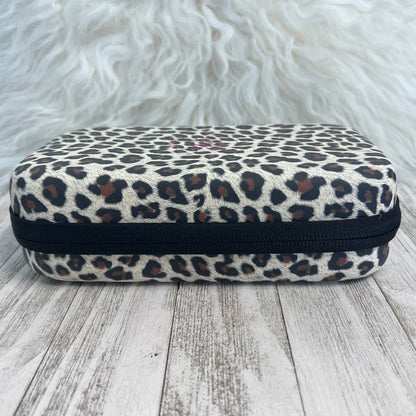 Travel Size Leopard Print Fancy Band Storage Case — Case made of PU leather, Nylon, Multi spandex, Lycra Dimensions are W 8 1/2" x L 5 1/2" x H 2 1/4" This item is storage case only bands not inclu...