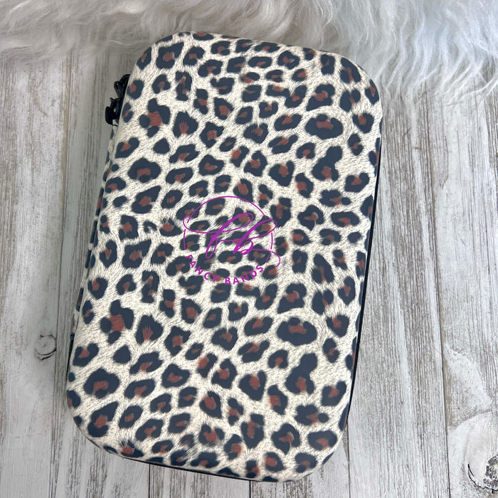 Travel Size Leopard Print Fancy Band Storage Case — Case made of PU leather, Nylon, Multi spandex, Lycra Dimensions are W 8 1/2" x L 5 1/2" x H 2 1/4" This item is storage case only bands not inclu...