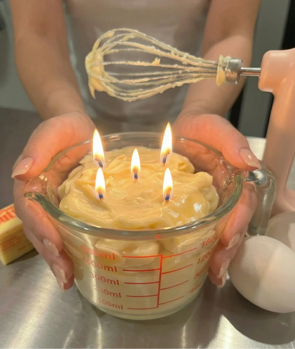 Realistic dessert-inspired candle with four flames in a measuring cup, kitchen setting