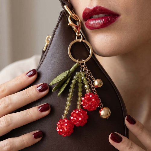 Cherry bag charm with glossy acrylic beads, raffia fringe and metal chain detail for totes