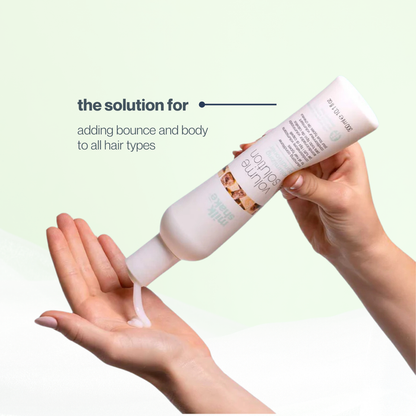 Hand holding a bottle of milk_shake  hair product with text on a light green background