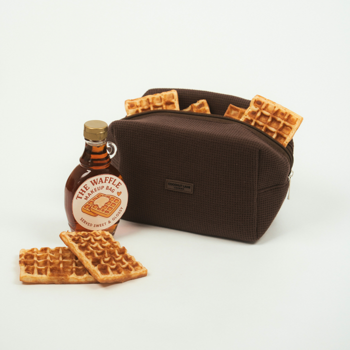 Brown Coconut Lane makeup bag with a textured waffle pattern and zip closure.