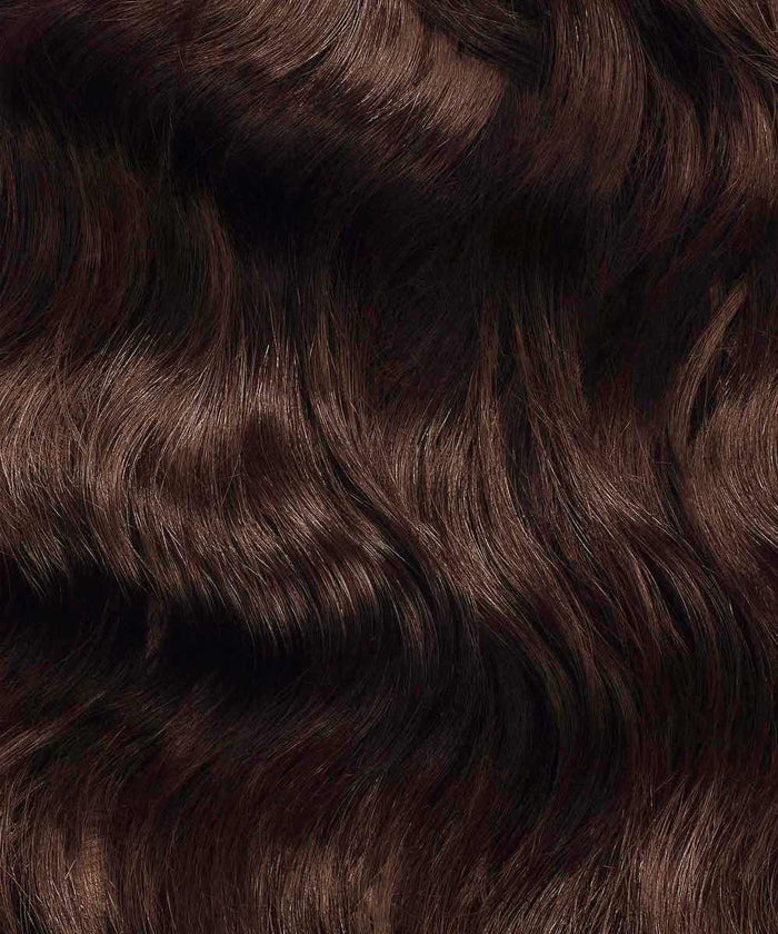 Close-up of Perfect Locks Wavy Fusion I-Tip Hair in Chocolate Brown, shiny Remy extensions with wavy texture and subtle highlights.#color_chocolate-brown-(3)