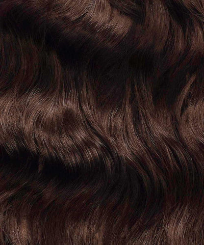 Close-up of Perfect Locks Wavy Fusion I-Tip Hair in Chocolate Brown, shiny Remy extensions with wavy texture and subtle highlights.#color_chocolate-brown-(3)